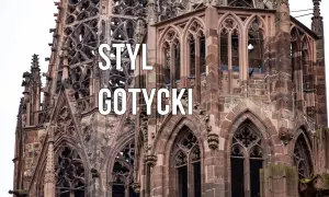 Kamienna katedra z licznymi zdobieniami, ostrymi łukami i rozetami. Widoczne są charakterystyczne cechy stylu gotyckiego: strzelistość, bogactwo detali architektonicznych i kamienne gargulce.