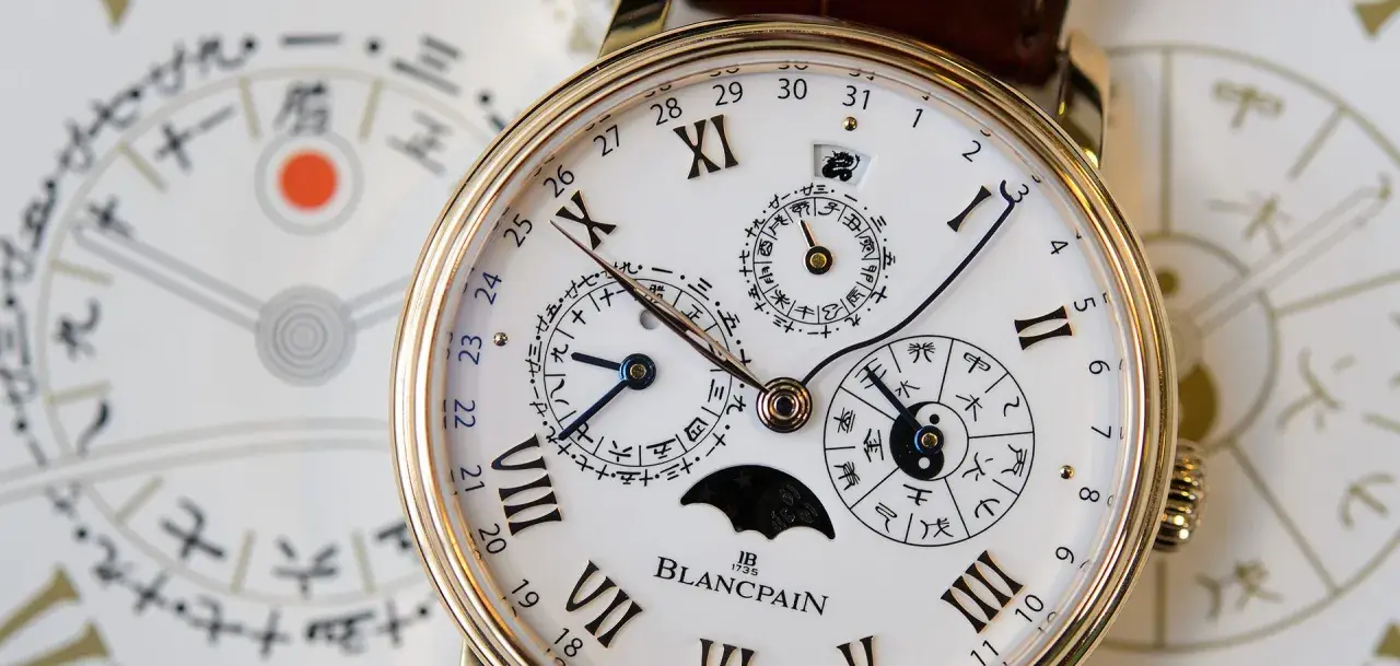 Zegarek Blancpain z tarczą kalendarza gregoriańskiego i chińskimi symbolami.
