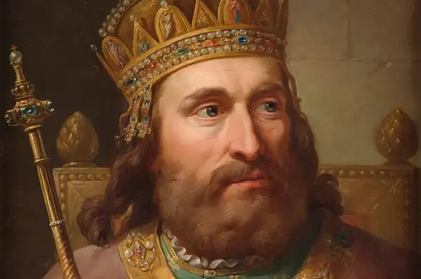 Portret króla w bogatej koronie i z berłem, symbolizujący jego koronację i władzę.
