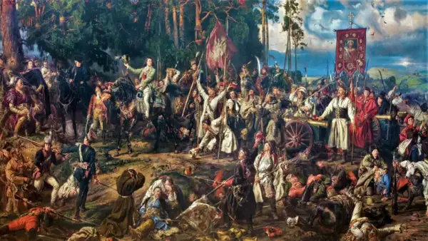 Bitwa insurekcji kościuszkowskiej. Polacy walczą z wrogiem, sztandar z Matką Boską powiewa nad armatami.